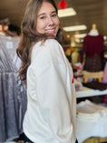Load image into Gallery viewer, Side view of the model wearing the relaxed-fit AR sweatshirt, demonstrating the premium boutique quality found in Fayetteville boutiques.
