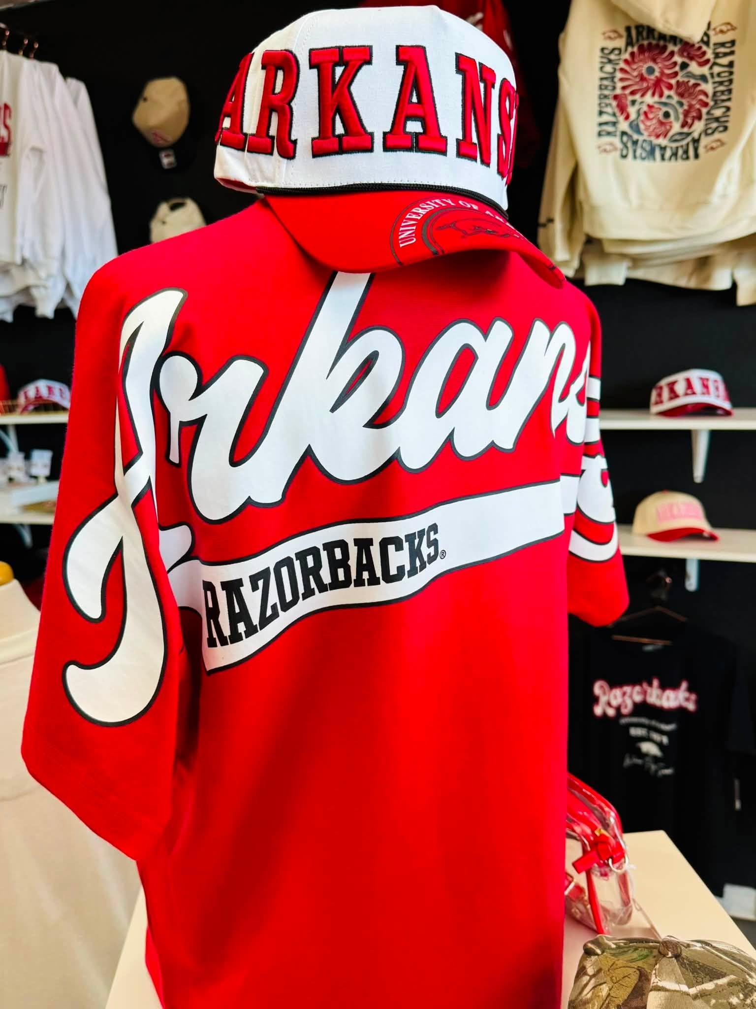 Back view of oversized crimson Arkansas Razorback game day tee featuring relaxed fit for women shopping Razorback apparel in Fayetteville Arkansas.