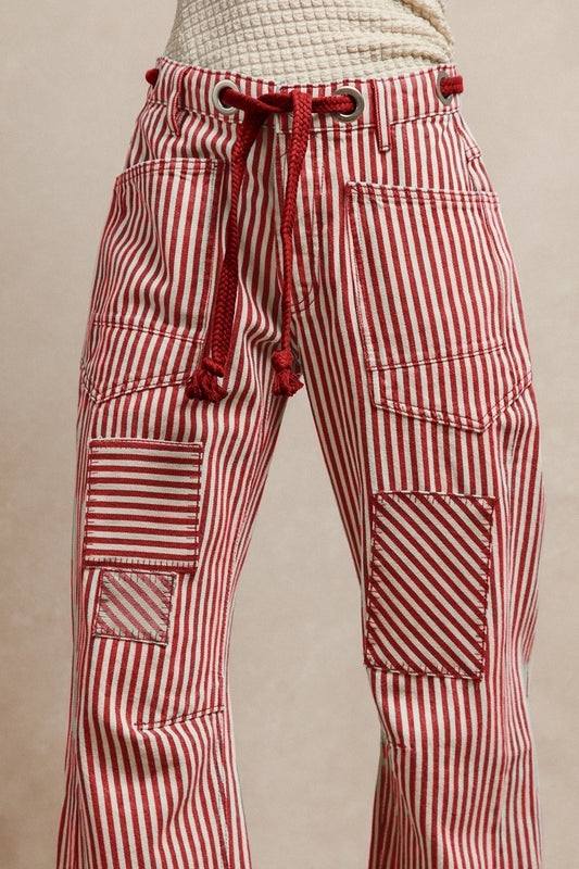 Something Good Pull-On Barrel Pants featuring vertical red and white stripes and a modern curved-leg silhouette, available at Whimsy Whoo in Fayetteville, Arkansas.