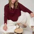 Load image into Gallery viewer, The back view of the burgundy textured knit polo showing the vertical exposed seam detailing. Shop this unique style at Whimsy Boutique, the best boutique near me for high-quality spring fashion.
