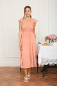 Load image into Gallery viewer, Shop the Peachy Keen Flutter Smocked Dress at Whimsy Boutique, a top-rated Arkansas boutique. This tiered midi dress with flutter sleeves is the perfect spring staple for your next event in Fayetteville.

