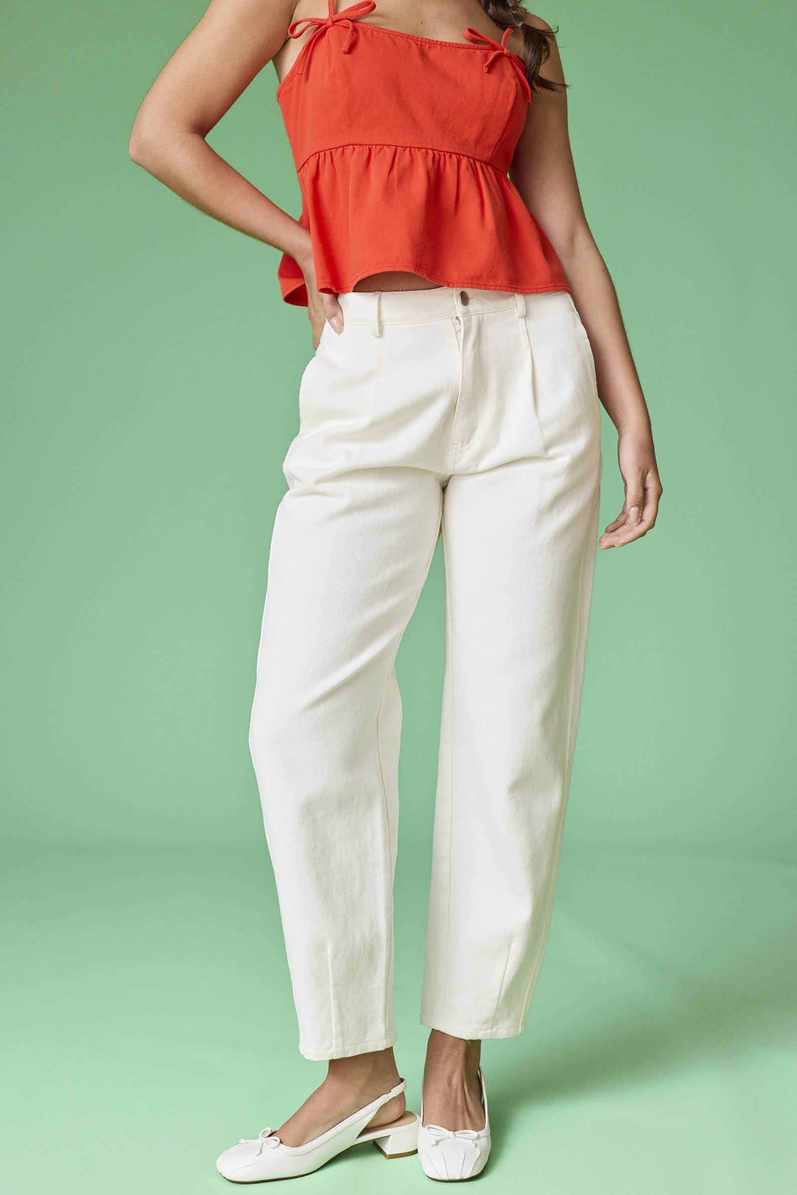 A front view of the Executive Edge Barrel Pants in off-white, featuring a mid-rise waist and a modern wide-leg barrel silhouette.